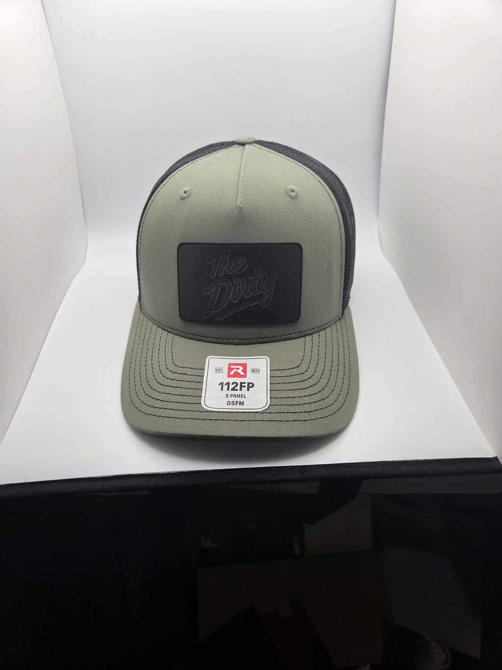 The Dirty black patch Richardson 112FP trucker hat in olive and black