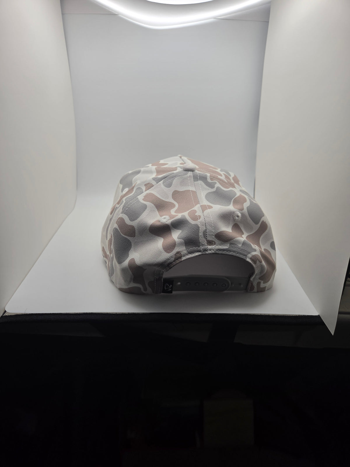 Rear view of the TOAD light camo hat with adjustable snapback