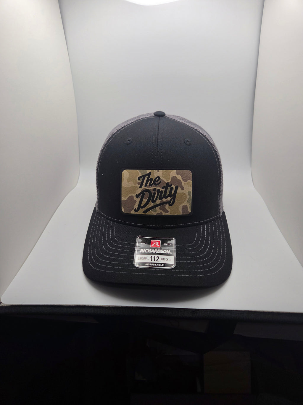 The Dirty camo patch Richardson 112 trucker hat in black and gray
