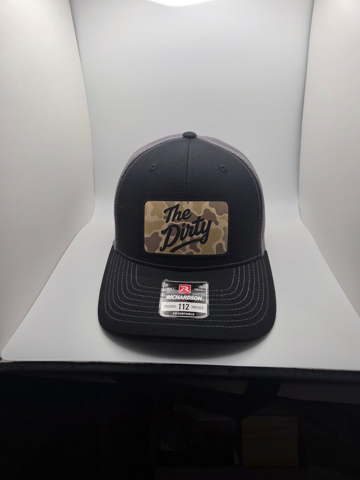 The Dirty camo patch Richardson 112 trucker hat in black and gray