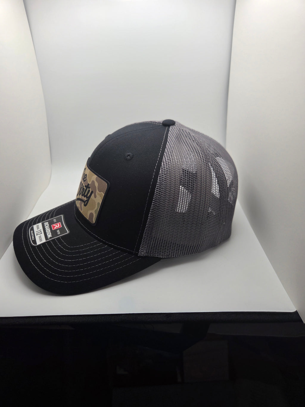 The Dirty camo patch Richardson 112 trucker hat in black and gray