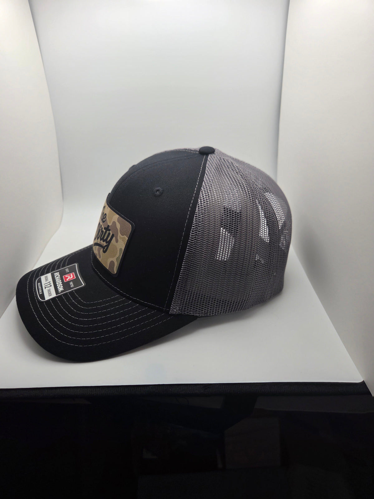 The Dirty camo patch Richardson 112 trucker hat in black and gray